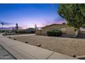 Single-level home with low-maintenance landscaping, offering a clean and tidy curb appeal at 3537 W Shangri La Rd, Phoenix, AZ 85029