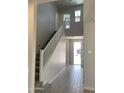 Open foyer area with a staircase, wood-look tile flooring, and plenty of natural light at 4924 W Brown St, Glendale, AZ 85302