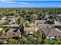 Wide aerial shot displaying a neighborhood with mature trees and community pool at 538 W Las Palmaritas Dr, Phoenix, AZ 85021