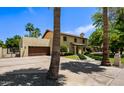 Charming two-story home with a spacious driveway and well-manicured landscaping at 538 W Las Palmaritas Dr, Phoenix, AZ 85021