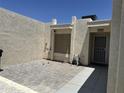 Enclosed brick-paved patio surrounded by stucco walls and featuring desert landscaping at 632 W Fordham Dr, Tempe, AZ 85283