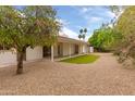 Backyard featuring a covered patio and drought landscaping at 8411 E Via De Jardin --, Scottsdale, AZ 85258