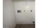 Functional laundry room with standard hookups and basic storage at 990 E Desert Rose Trl, San Tan Valley, AZ 85143