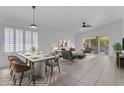 Open-concept dining and living areas with large windows for natural light and seamless entertaining at 1405 E Chicago Cir, Chandler, AZ 85225