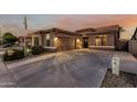 Lovely single-story home boasting desert landscaping, a spacious driveway, and a convenient two-car garage at 16077 W Anasazi St, Goodyear, AZ 85338