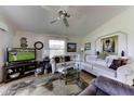 Cozy living room with comfortable sectional, flat-screen TV, and decorative accents for a relaxing ambiance at 17200 W Bell Rd # 1602, Surprise, AZ 85374