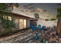 Serene backyard patio with dining set, offering a private outdoor space for entertaining and relaxation at 1807 E Jamaica Ave, Mesa, AZ 85204