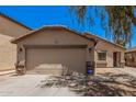 A closer look at a well-kept two car garage in front of a beautiful single story home at 2516 E San Manuel Rd, San Tan Valley, AZ 85143