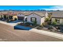 An aerial view of this beautiful home showing the landscaping and tile roofing at 25979 W Taro Dr, Buckeye, AZ 85396