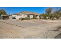 Single story home featuring an attached two-car garage and circular driveway at 2602 S 226Th Dr, Buckeye, AZ 85326