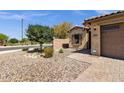 Attractive single-story home with desert landscaping, brick driveway and a ring doorbell at 2670 E Bellerive Dr, Gilbert, AZ 85298