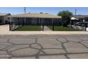 Charming home featuring a low fence with artificial turf and a lovely walkway at 2831 W Montecito Ave, Phoenix, AZ 85017
