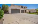 Two-story home featuring a wide driveway leading to a three-car garage, combining functionality with a classic design at 3059 E Parkview Dr, Gilbert, AZ 85295