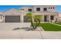 Charming two-story home with a well-manicured lawn, complemented by a spacious driveway and a three-car garage at 3059 E Parkview Dr, Gilbert, AZ 85295