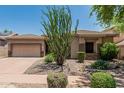 Lovely home featuring low-maintenance desert landscaping and a two-car garage at 35729 N 32Nd Ave, Phoenix, AZ 85086