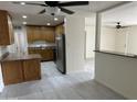 Bright kitchen featuring wooden cabinets, stainless appliances, and an open floor plan at 4502 N 50Th Ave, Phoenix, AZ 85031