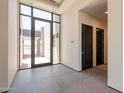 Bright, airy foyer with floor-to-ceiling windows and dark doors at 5145 N Ascent Dr, Scottsdale, AZ 85251