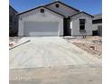 A single story white house with an attached garage is under construction at 6022 E Artemis Dr, Florence, AZ 85132