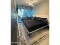 Modern bedroom with balcony access, stylish lighting, and sleek wardrobe cabinets at 7120 E Kierland Blvd # 404, Scottsdale, AZ 85254