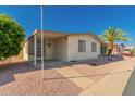 Charming single-story home featuring a covered entrance, carport and low-maintenance rock landscaping at 8103 E Southern Ave # 69, Mesa, AZ 85209
