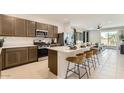 Beautiful kitchen with a central island, stainless steel appliances, and an open layout at 9621 W Monterey Way, Phoenix, AZ 85037