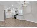 Bright, newly renovated kitchen with white cabinets, subway tile backsplash, and modern appliances at 1051 S Dobson Rd # 67, Mesa, AZ 85202