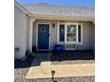 Inviting front entrance with a blue door, decorative wreath, and bay window adding charm and natural light at 1319 E Piute Ave, Phoenix, AZ 85024