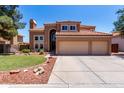 Beautiful two-story home with a three-car garage and neatly arranged front yard landscaping at 1521 W Kent Dr, Chandler, AZ 85224