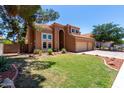 Charming two-story home featuring a well-kept lawn and a convenient three-car garage at 1521 W Kent Dr, Chandler, AZ 85224