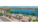 Gorgeous waterfront home with meticulous landscaping, a private pool, and breathtaking lake views at 18088 W San Alejandro Dr, Goodyear, AZ 85338