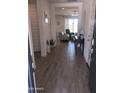 Bright entryway with tile floors leading to the living space with comfortable furniture at 25109 N 173Rd Dr, Surprise, AZ 85387