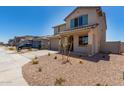 Attractive new home with low maintenance desert landscaping, and inviting curb appeal at 31822 N Bandit Rd, San Tan Valley, AZ 85143