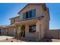 Beautiful two-story home featuring a covered front porch and desert landscaping at 31822 N Bandit Rd, San Tan Valley, AZ 85143