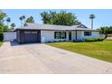 Charming single-story home featuring a well-maintained front yard and attached garage at 541 W Marlette Ave, Phoenix, AZ 85013