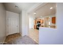 Open kitchen featuring a view of the carpeted Gathering room at 5418 W Carson Rd, Laveen, AZ 85339