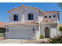 Inviting two-story home featuring a neutral-colored exterior, arched entryway, and manicured landscaping at 742 W Vineyard Plains Dr, San Tan Valley, AZ 85143