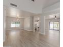 Open-concept living area featuring wood-look floors and seamless flow to the kitchen at 742 W Vineyard Plains Dr, San Tan Valley, AZ 85143
