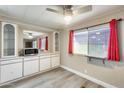 Bright dining area featuring built in cabinets, a serving counter and large window at 8103 E Southern Ave # 170, Mesa, AZ 85209
