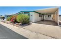 Charming home featuring a covered carport, mature landscaping, and appealing light blue trim at 8103 E Southern Ave # 170, Mesa, AZ 85209