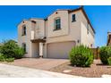 Lovely two-story home with brick driveway, two-car garage, desert landscaping, and covered entry at 10625 S 55Th Dr, Laveen, AZ 85339