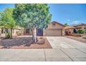 Charming single-Gathering home with desert landscaping, mature trees, and a two-car garage at 11318 W Monte Vista Rd, Avondale, AZ 85392