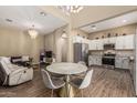 Open-concept room showing kitchen, dining area and living room at 1367 S Country Club Dr # 1331, Mesa, AZ 85210