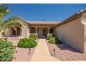 Inviting front entrance with a well-maintained walkway and desert landscaping at 15314 W Pantano Dr, Surprise, AZ 85374