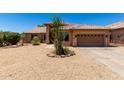 Charming single-Gathering home with desert landscaping and a tile roof, offering a warm curb appeal at 20670 N 41St Ave, Glendale, AZ 85308