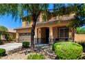 Beautiful two-story home featuring a manicured lawn, covered porch, and a two-car garage at 27189 N 75Th Dr, Peoria, AZ 85383