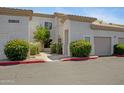 Inviting condo exterior with lush landscaping and well-maintained grounds at 3236 E Chandler Blvd # 2018, Phoenix, AZ 85048