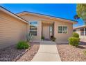 Inviting front entrance with desert landscaping and a paved walkway at 3301 S Goldfield Rd # 1048, Apache Junction, AZ 85119