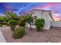 A bright home exterior with a manicured landscape, stone-covered ground and charming architectural details at 3884 S Wilson Dr, Chandler, AZ 85286