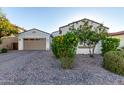 Charming home featuring a well-maintained front yard and a two-car garage with a spacious driveway at 3884 S Wilson Dr, Chandler, AZ 85286