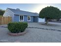 Charming home featuring a well-maintained front yard with mature trees and decorative rock landscaping at 4608 W Gail Dr, Chandler, AZ 85226